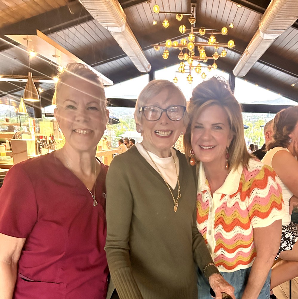 Three members of the SYNERGY HomeCare of North County team smiling together